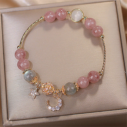 Bracelet en pierre naturelle avec pendentifs.